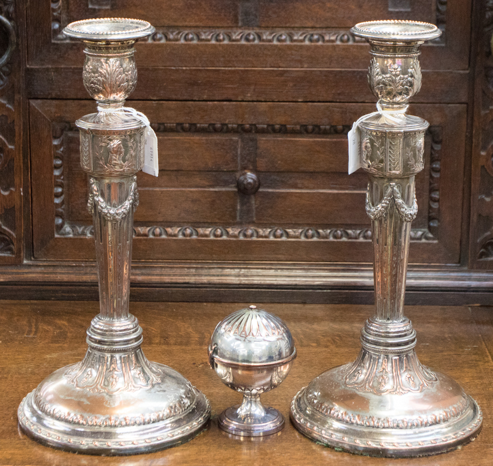 A pair of silver plated candlesticks with swag decoration,