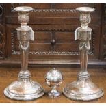 A pair of silver plated candlesticks with swag decoration,