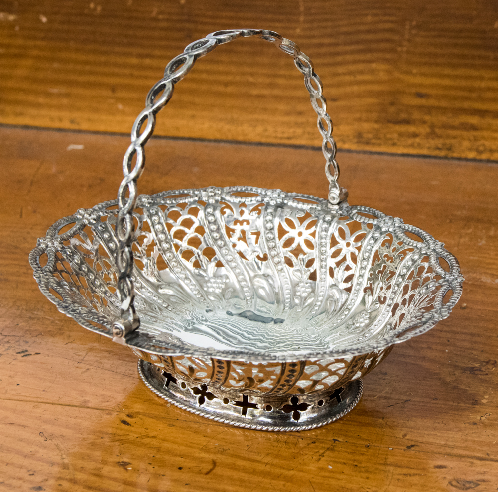 A silver oval bon bon basket with pierced decoration, part hallmark, probably William Plummer,