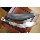 Indian made souvenir Kukri knife with 28cm plated blade with some decoration. One small knife only.