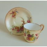 A Royal Worcester coffee cup and saucer, blush ground with floral sprays, circa 1909, sizes approx,