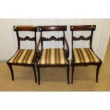 A set of seven early 19th Century mahogany dining chairs