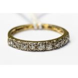 A diamond half eternity ring, claw set in platinum with eleven graduated old-cut diamonds,