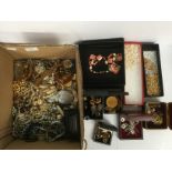 A box of assorted costume jewellery including pearls, watches,