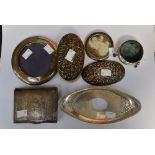 Eight items of silver, two silver backed hairbrushes, two frames, a cigarette case, thimble,