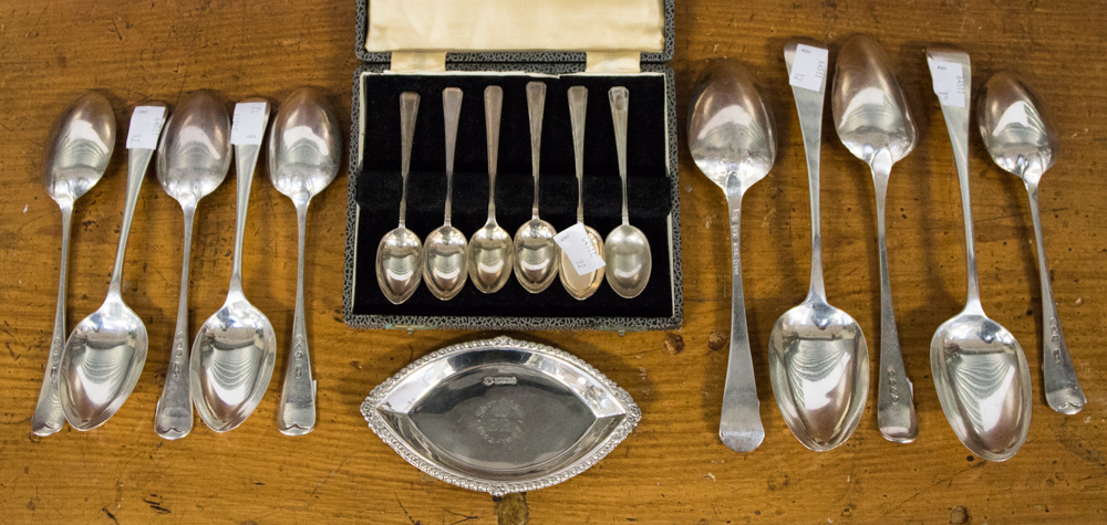 A cased set of silver teaspoons, Sheffield 1948/49, ten silver table and dessert spoons,