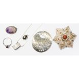 A collection of silver jewellery including textured oval pendant,