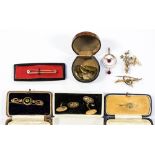 A collection of Edwardian brooches and cufflinks in 9ct gold and yellow metal,