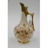 A Royal Worcester ivory finish ewer, bottle form with angular gilt handle, foliate gilt decoration,