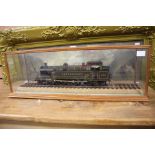 A model of an Abergavenny locomotive, 4-6-2, 325, brown livery, within a glass case, signed J.