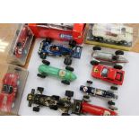 A collection of assorted boxed and unboxed cars to include: Dinky Ford GT, 23J H.W.M.