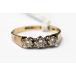 Three stone diamond ring, claw set in 9ct gold, size L1/2 with a total gross weight approx 1.