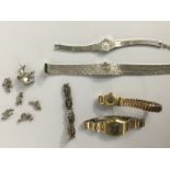 Ladies watches and silver charms;