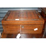 A Victorian rosewood work box with silk lined interior