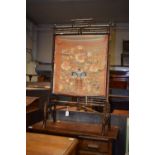 A late 19th century bamboo fire screen with silk panel (distressed)