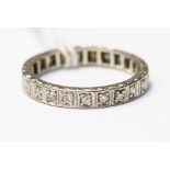 A diamond full eternity ring, set in white metal (probably platinum), grain set, approx 25 diamonds,