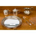 A small silver tray with a mirror insert, Birmingham 1986, a jug, Birmingham, a condiment pot,