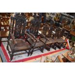 A set of seven Victorian Carolean style oak dining chairs,