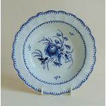 Liverpool blue and white shallow dish with a scalloped rim and floral decoration, circa 1765,