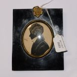 A miniature silhouette painting on card, of a gentleman, in an ebonised frame,