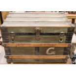 A late 19th Century steel bound wooden travelling chest,