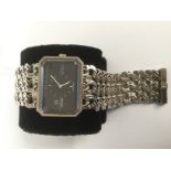 A ladies silver Omega De Ville wristwatch, octagonal face with charcoal grey face,