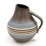 A late 1950''s German Art Pottery jug, matt pastel blue and brown stylized decoration,