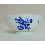 A Worcester blue and white slop bowl, decorated with 'dry Blue' flower sprays and gilt dentil rim,