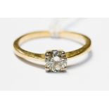 An diamond solitaire, claw set in 18ct, diamond weight approx 0.