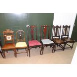 A collection of chairs, comprising a pair of Victorian oak chairs,