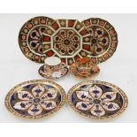 Five Royal Crown Derby 1128 pattern plates, a cup and saucer and an early cup,