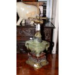 A Chinese carved jade and hardwood lamp base Please note: this items has failed its PAT test and