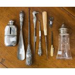 A collection of silver including an Edwardian cut glass sugar castor with silver piece and