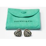 A pair of heart shaped silver Tiffany earrings in original box