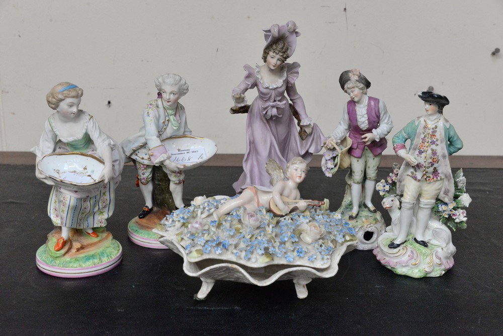 Five continental figurines: a lady and gentleman; sweet dish pair; a gentleman with dog;