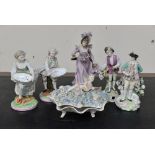 Five continental figurines: a lady and gentleman; sweet dish pair; a gentleman with dog;