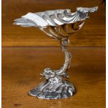 A silver plate Victorian style bon bon dish, shell bowl above Dolphin support on stylised wave base,