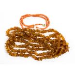 An amber necklace of rough irregular bends, approx 160cms long,