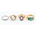 An turquoise 18ct gold ring, three oval cabochon cut turquoise (one discoloured), ring size N½,