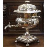 A large silver plated tea urn, wood handles,