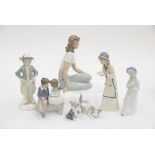 A Ladro figure of a cat and mouse, a Lladro figure of a cat, two Nao figures, a Rex Valencia figure,