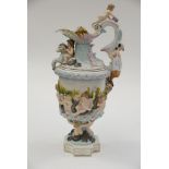 An early 20th Century Rudolstadt hand painted jug with applied cherubs, horses,