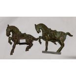 Two Chinese bronze figures of leaping horses,