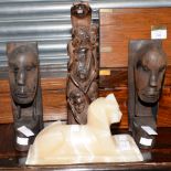 A marble Sphinx, together with an African carving,