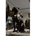 A 20th Century bronze study of a seated pointer dog