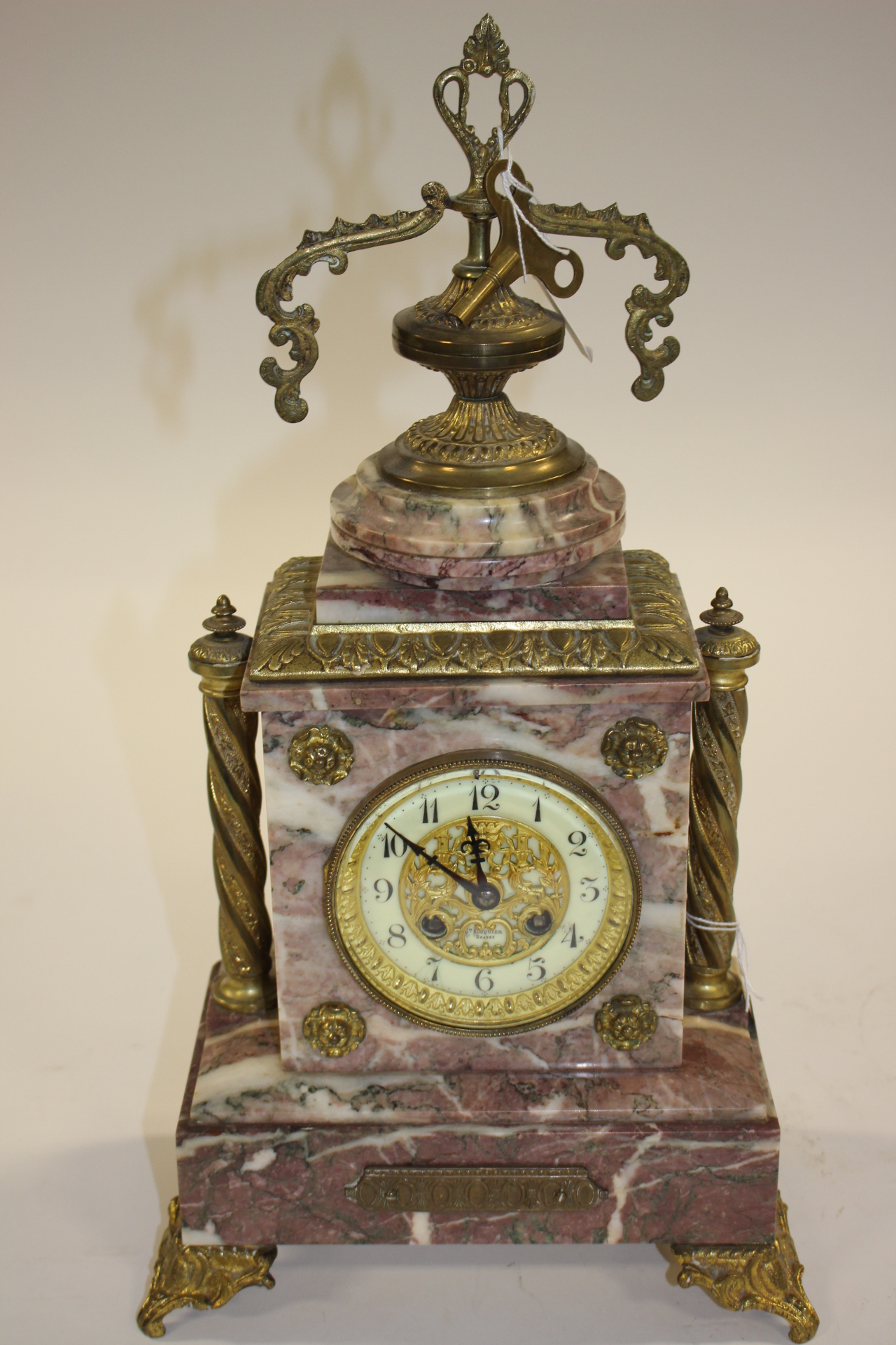 French, red marble clock with ornate brass work to face,