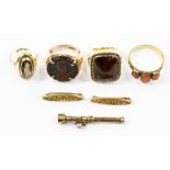 Four yellow metal and gem and set gold rings together with two yellow metal bar brooches and a