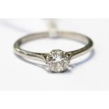 A diamond and platinum solitaire, the brilliant cut diamond, claw set, weighing approx 0.