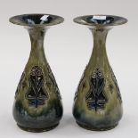 A pair of Doulton Lambeth vases in raised Art Nouveau decoration (2) signed to base