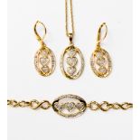A set of three diamond set yellow metal jewellery items, comprising necklace,